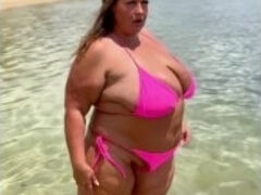 Fat wet BBW MILF plays in water